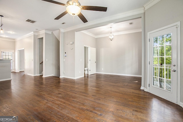 unfurnished living room with dark wood-type flooring, crown molding, plenty of natural light, and ceiling fan with notable chandelier