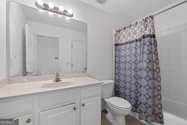 full bathroom with tile patterned flooring, shower / bath combination with curtain, vanity, and toilet