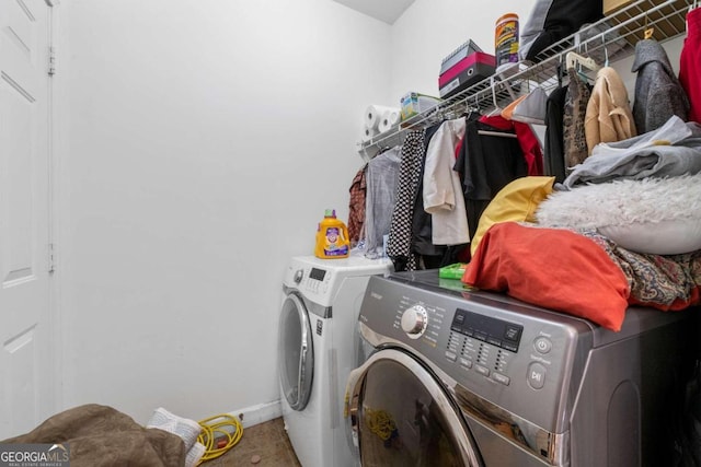 laundry area with washing machine and dryer