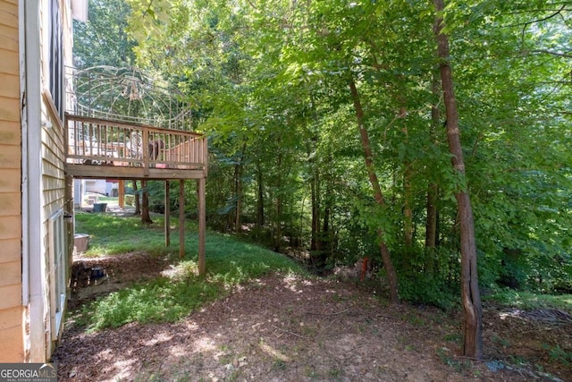 view of yard featuring a wooden deck