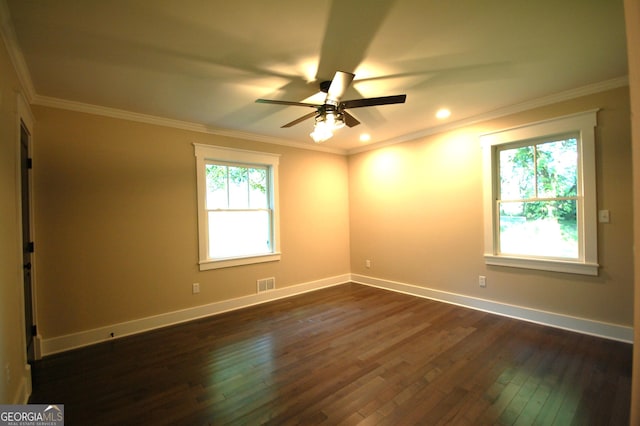 empty room with dark wood-type flooring, ornamental molding, and ceiling fan