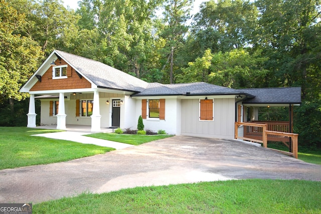 view of front of property with a front yard and a porch