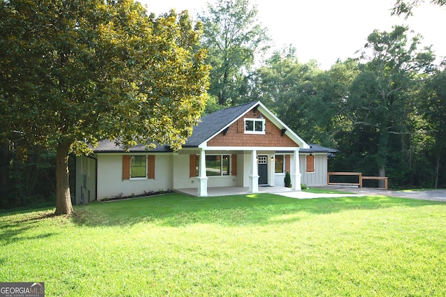 view of front of home with a porch and a front lawn