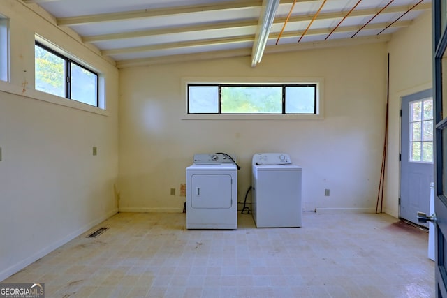 laundry area with laundry area, visible vents, baseboards, light floors, and washing machine and clothes dryer