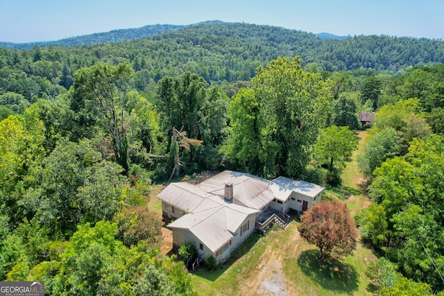 aerial view featuring a view of trees