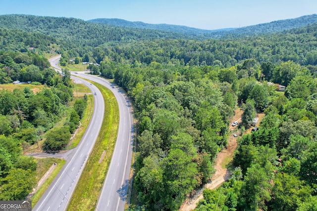 bird's eye view featuring a forest view