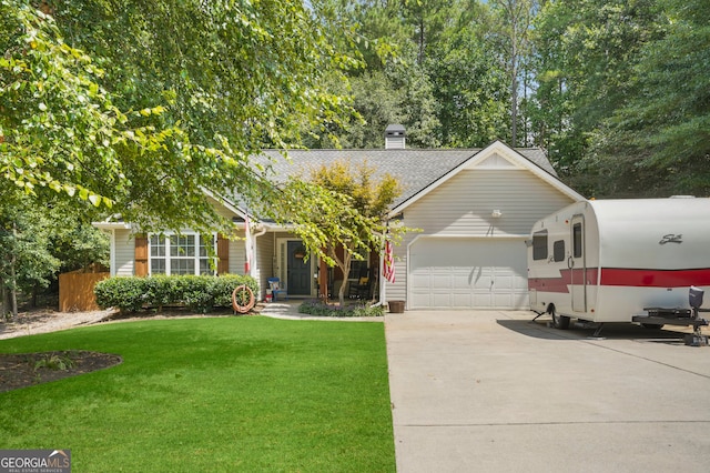 view of front of house featuring a front yard and a garage