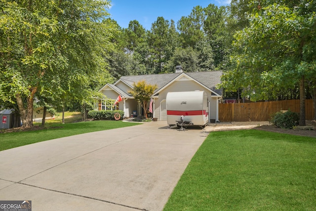 view of front facade with a garage and a front yard