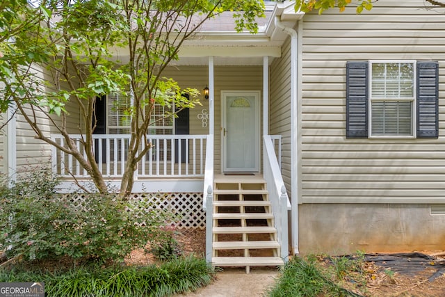 property entrance featuring a porch