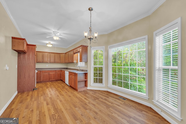 kitchen with dishwasher, ceiling fan with notable chandelier, hanging light fixtures, crown molding, and light hardwood / wood-style flooring