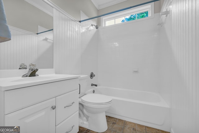 full bathroom featuring vanity, toilet, tiled shower / bath combo, and ornamental molding