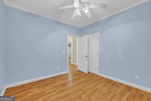 unfurnished room with ornamental molding, light wood-type flooring, and ceiling fan