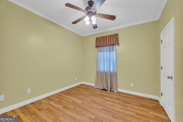 spare room with crown molding, light hardwood / wood-style floors, and ceiling fan