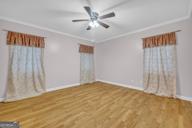 spare room featuring ornamental molding, light hardwood / wood-style floors, and ceiling fan