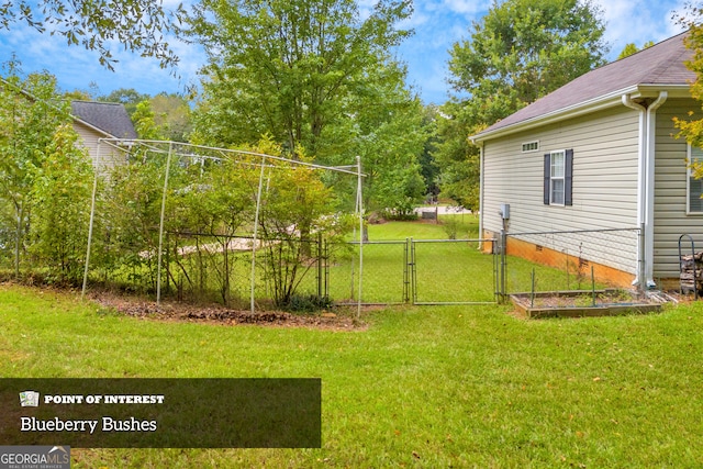 view of yard featuring a gate and fence