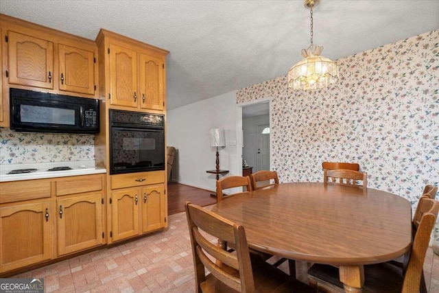 dining area featuring a notable chandelier, a textured ceiling, and light tile patterned floors