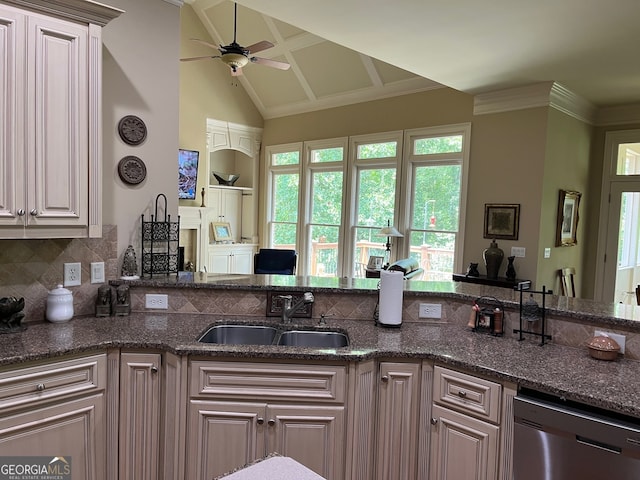 kitchen with backsplash, dishwasher, sink, dark stone counters, and ceiling fan