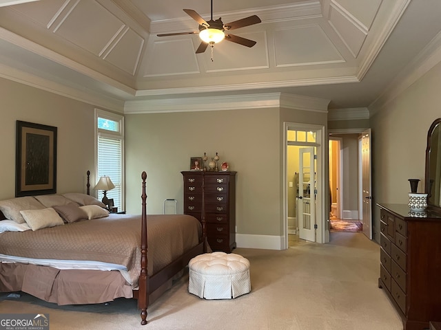 carpeted bedroom featuring ceiling fan, a raised ceiling, and crown molding