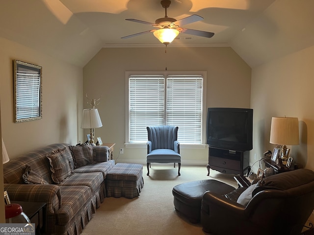 living room featuring ceiling fan, carpet, crown molding, and lofted ceiling