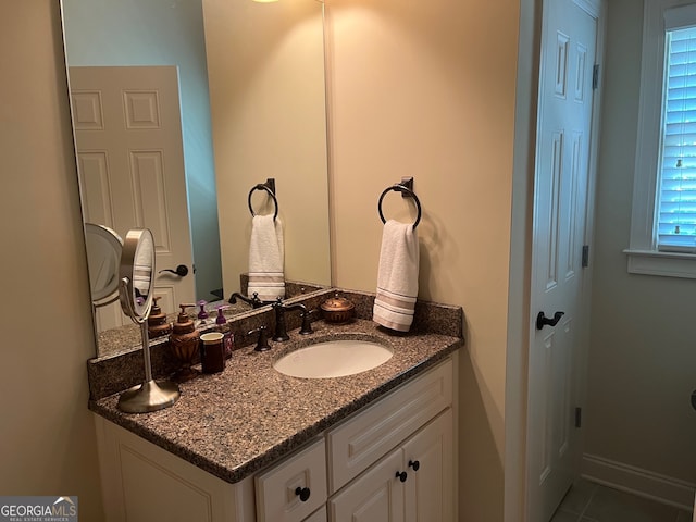 bathroom with tile patterned flooring and vanity