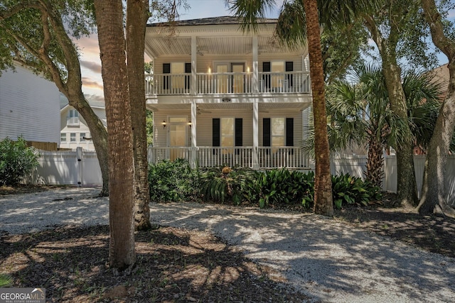 exterior space featuring a balcony and covered porch