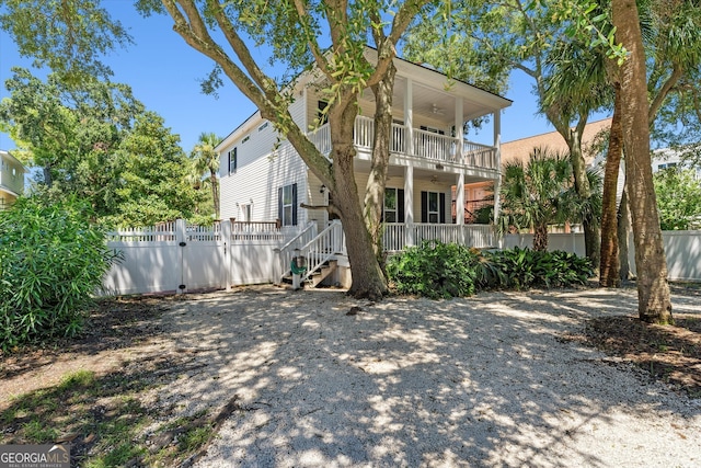 view of front of property with a balcony and covered porch