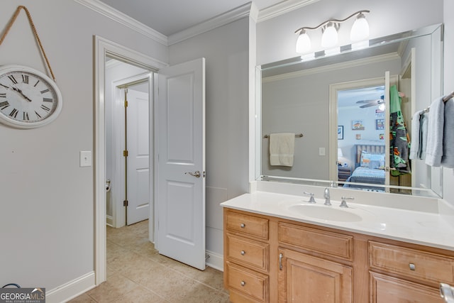 bathroom with ceiling fan, tile patterned floors, ornamental molding, and vanity