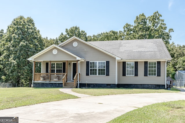 view of front of property with covered porch and a front yard