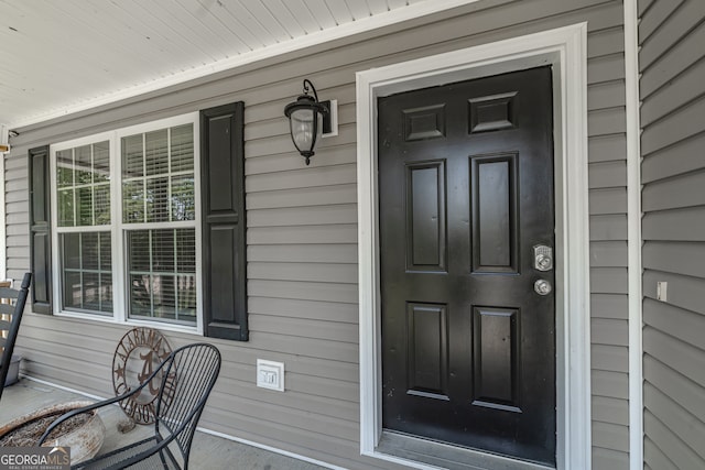 property entrance with covered porch