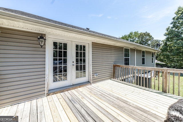 wooden terrace featuring french doors