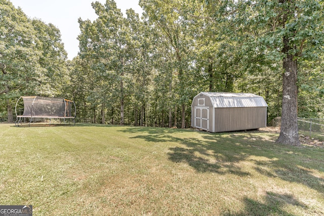 view of yard with a storage unit and a trampoline