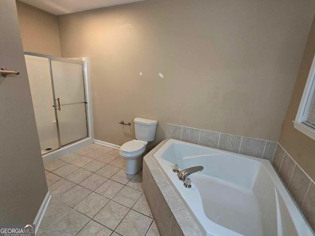 bathroom featuring plus walk in shower, tile patterned floors, and toilet