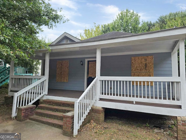 entrance to property with a porch