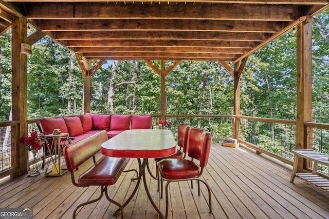 wooden terrace featuring outdoor lounge area