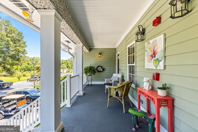 view of patio featuring a porch