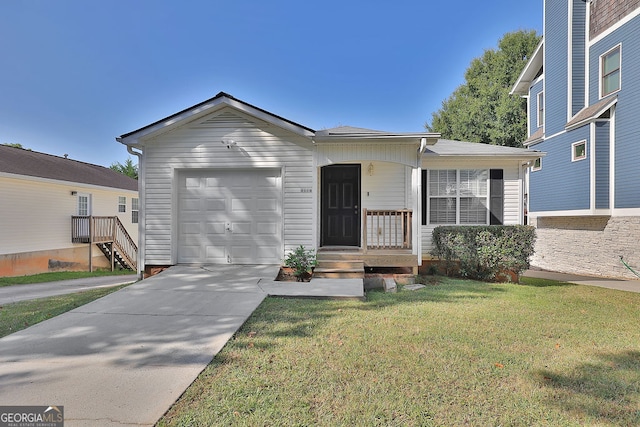 view of front of home with a garage and a front yard