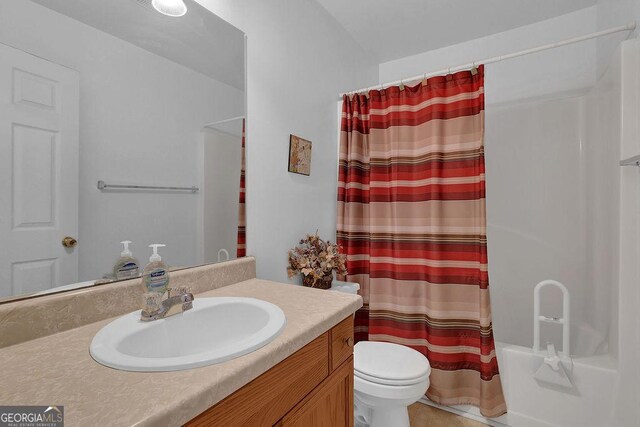 full bathroom featuring tile patterned flooring, toilet, shower / tub combo, and vanity