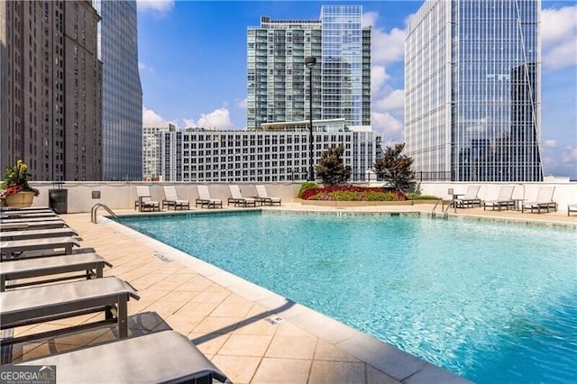 view of swimming pool featuring a patio