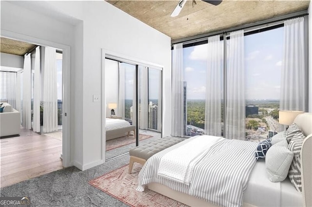 bedroom with ceiling fan and hardwood / wood-style floors