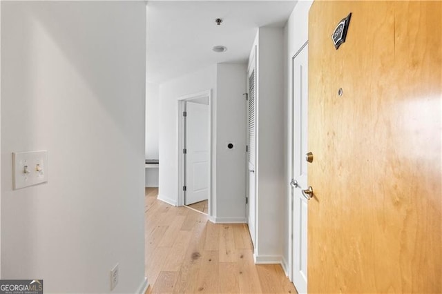 corridor featuring light hardwood / wood-style floors