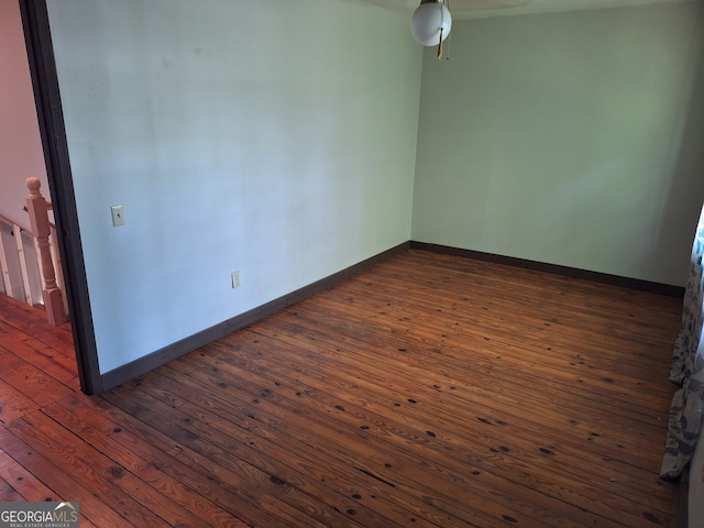 spare room featuring dark hardwood / wood-style floors