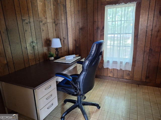 tiled office featuring wood walls