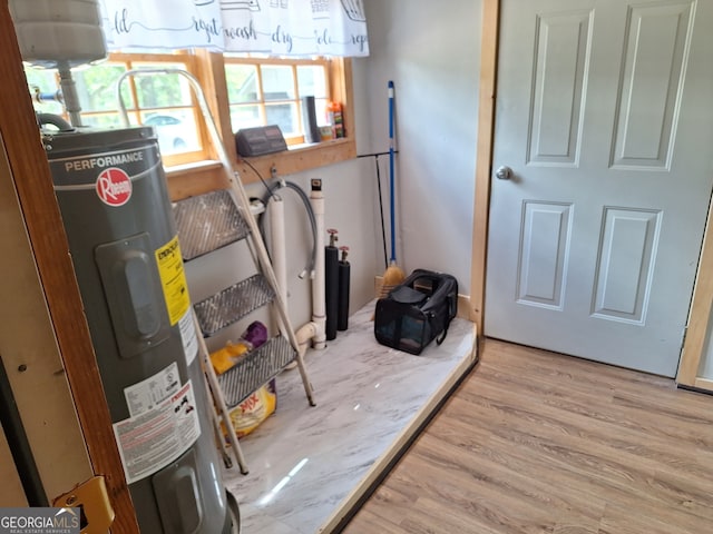 utility room featuring electric water heater