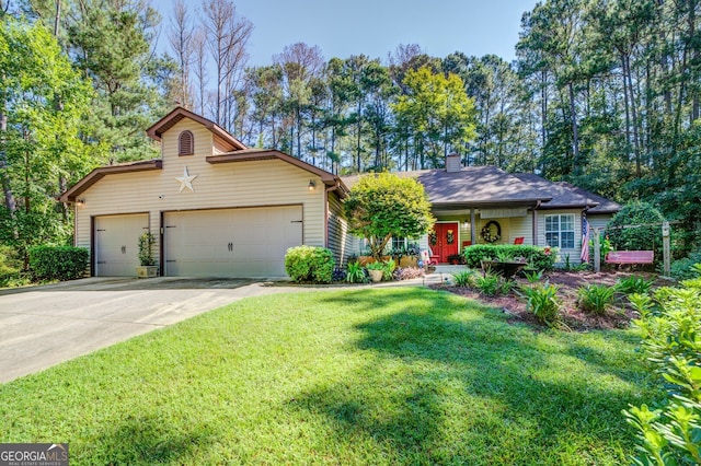 view of front facade with a front yard and a garage