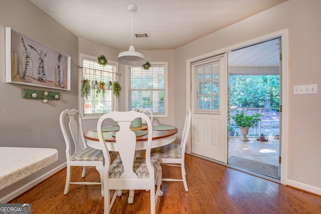 dining area featuring wood-type flooring