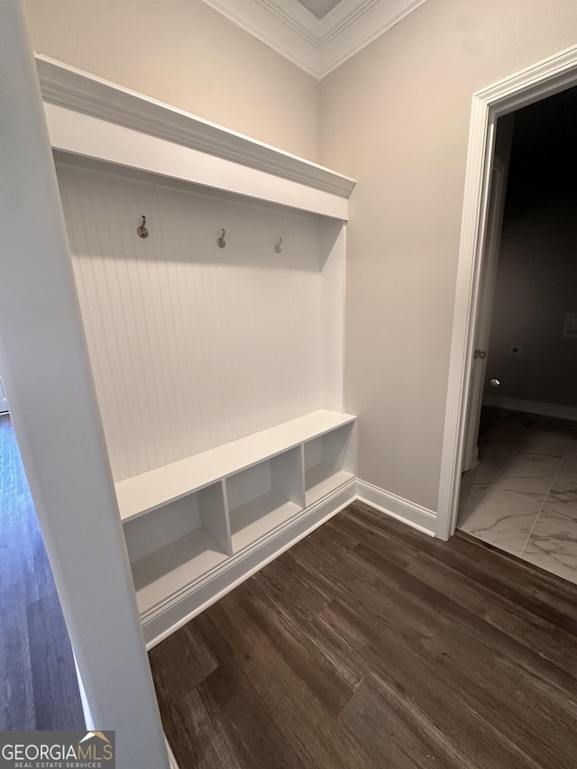 mudroom with dark hardwood / wood-style flooring and crown molding