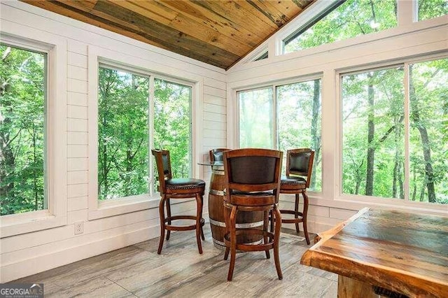 sunroom / solarium with wooden ceiling and vaulted ceiling