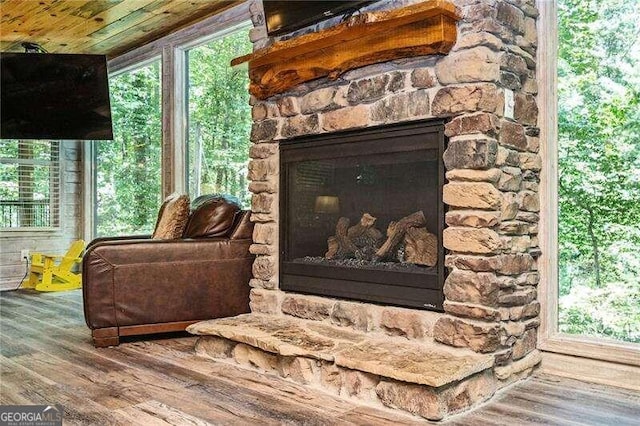 interior details with a fireplace and hardwood / wood-style floors