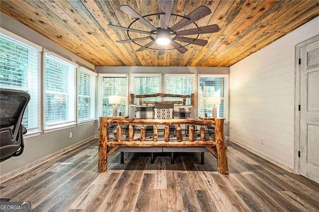 dining space with wooden ceiling, hardwood / wood-style flooring, and plenty of natural light