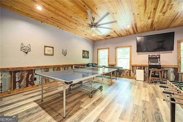 game room with ceiling fan, hardwood / wood-style flooring, and wooden ceiling